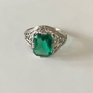Emerald-like green stone - glass or lab grown. 14k white gold ring.